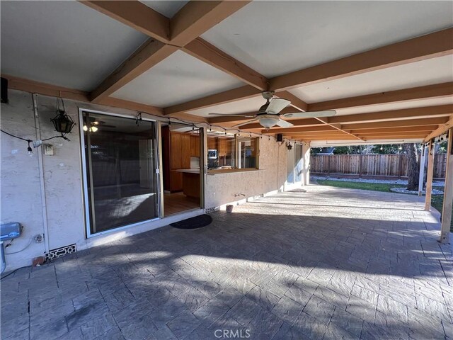 view of patio featuring ceiling fan