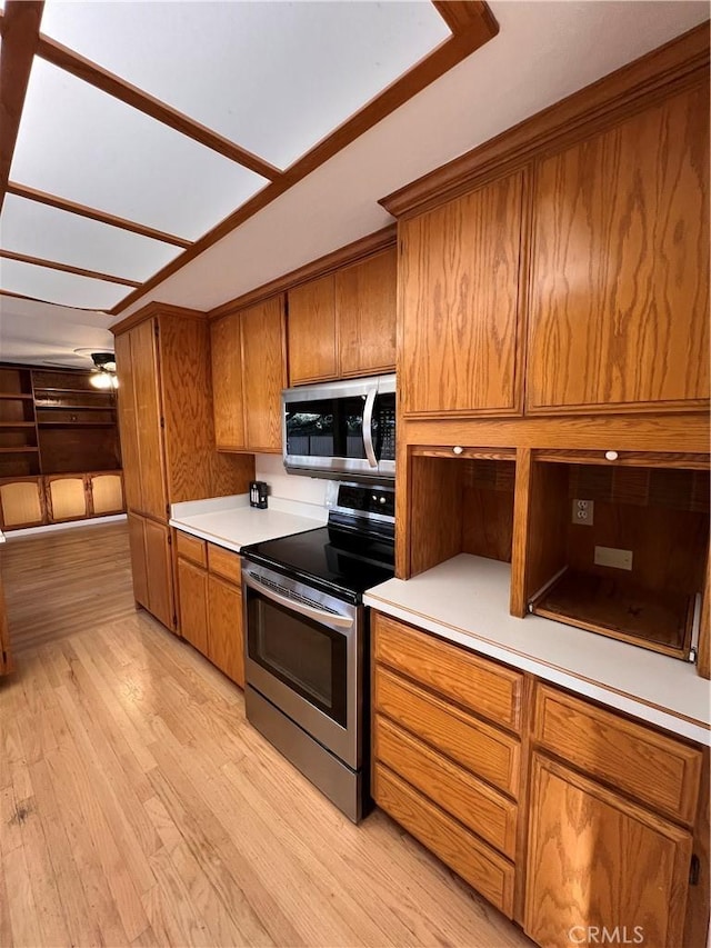 kitchen featuring appliances with stainless steel finishes and light wood-type flooring