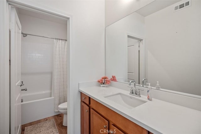 full bathroom featuring shower / tub combo with curtain, vanity, toilet, and wood-type flooring