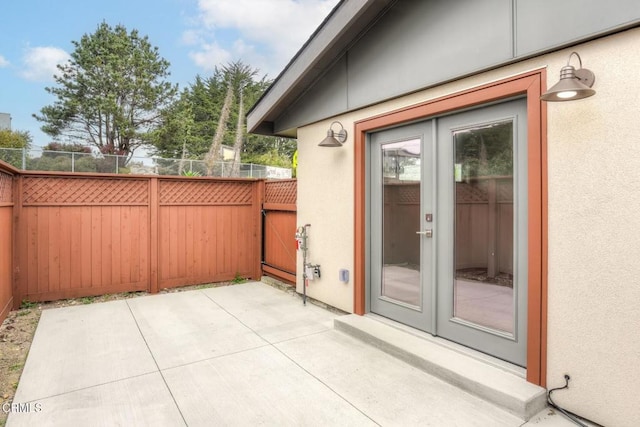 view of patio with fence and french doors