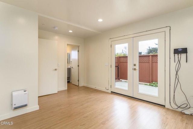 doorway featuring light wood-type flooring, french doors, baseboards, and recessed lighting