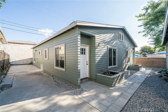 rear view of house with a patio