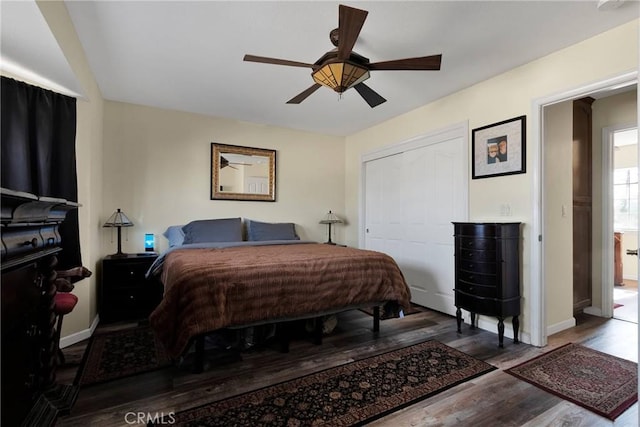 bedroom featuring hardwood / wood-style flooring, ceiling fan, and a closet