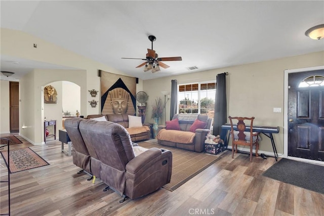 living room featuring ceiling fan, lofted ceiling, and hardwood / wood-style floors