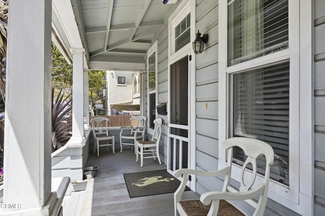 wooden terrace with a porch