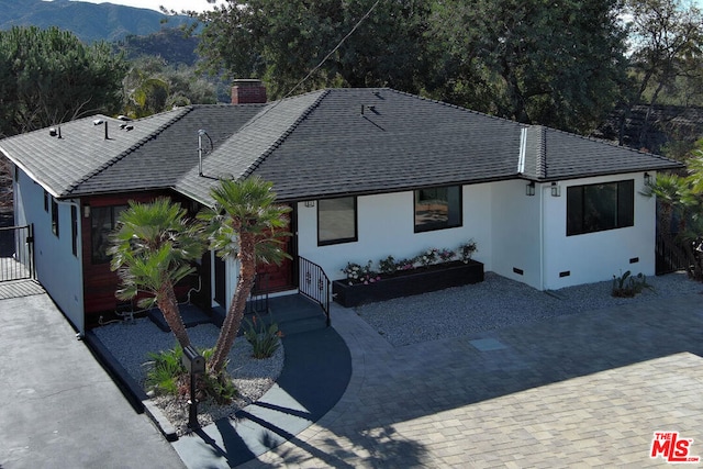 view of front of property with a mountain view