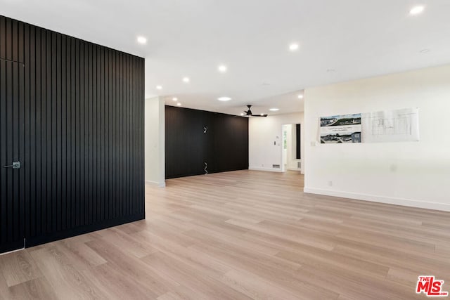 spare room with light hardwood / wood-style flooring and ceiling fan