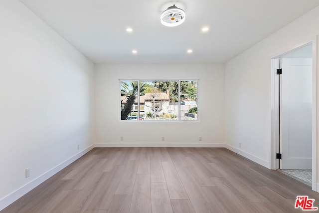 unfurnished room featuring light hardwood / wood-style flooring