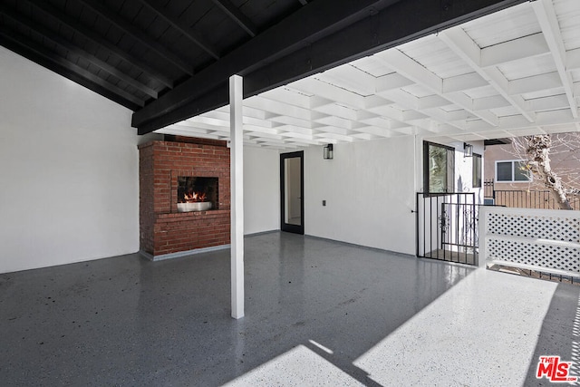 view of patio featuring a brick fireplace