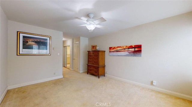 unfurnished room with light carpet and ceiling fan