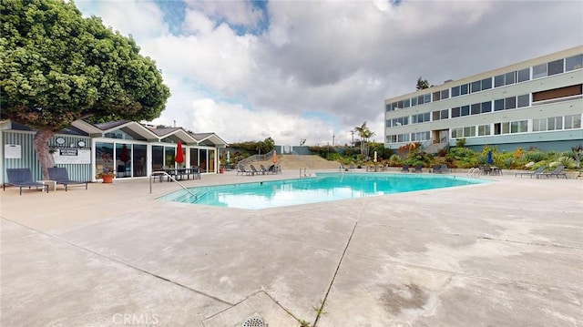 view of pool featuring a patio area