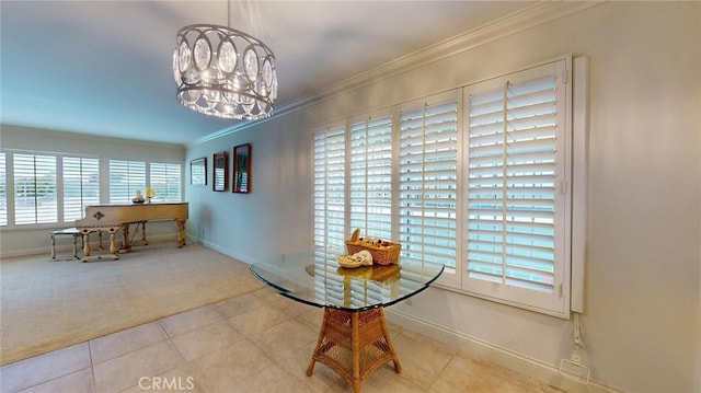 dining area with ornamental molding, light carpet, and a chandelier