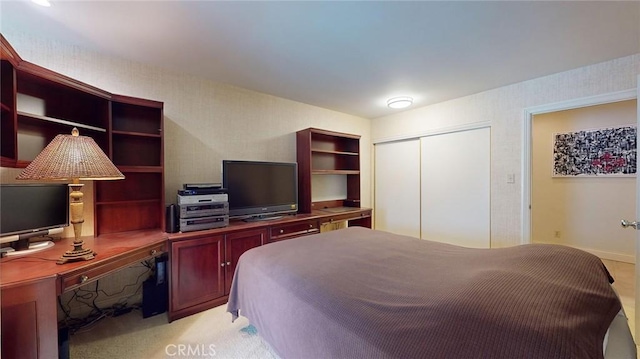 carpeted bedroom featuring a closet