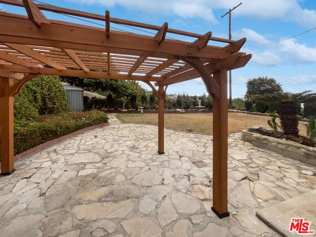 view of patio featuring a pergola