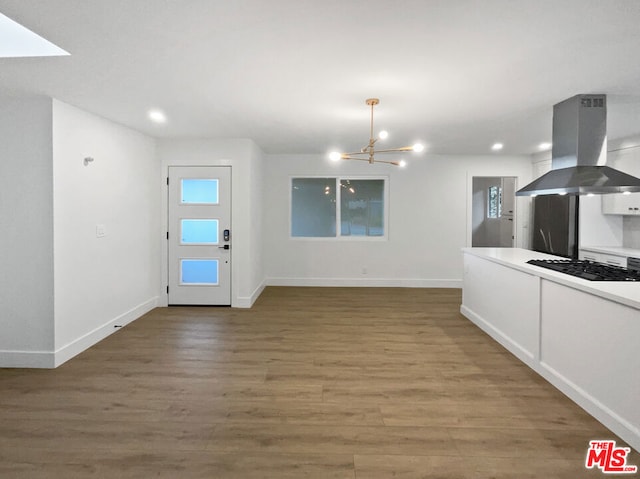 interior space with a chandelier and hardwood / wood-style floors