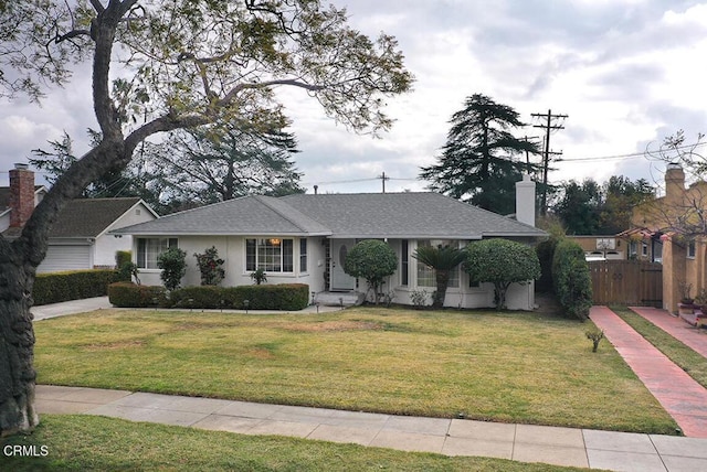 ranch-style house with a front lawn