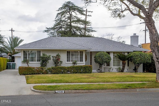 ranch-style home with a front lawn