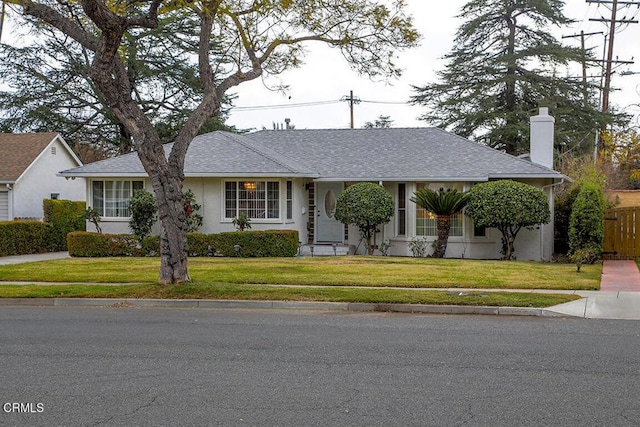 ranch-style house with a front yard