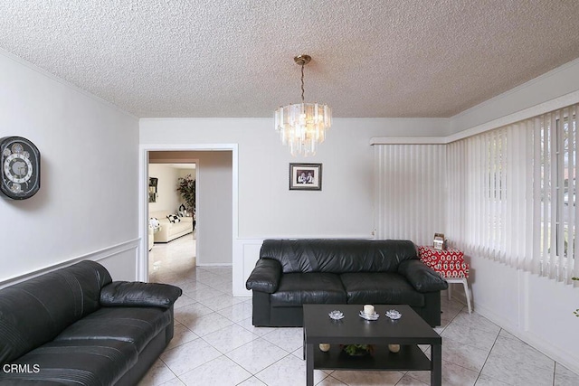 tiled living room featuring an inviting chandelier and a textured ceiling