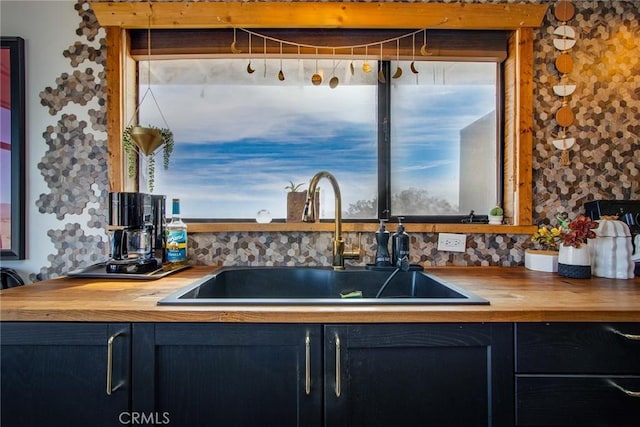 kitchen featuring tasteful backsplash, sink, and plenty of natural light