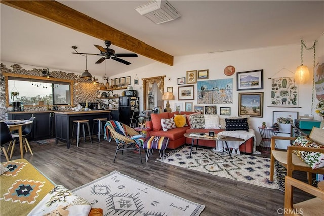 living room featuring lofted ceiling with beams, dark hardwood / wood-style floors, and ceiling fan