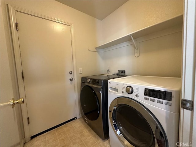 laundry area with washer and dryer