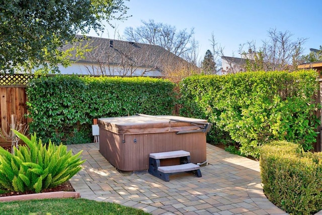 view of patio with a hot tub