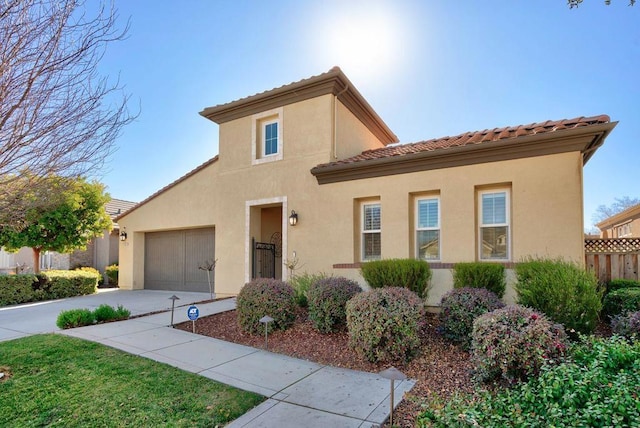 mediterranean / spanish-style house featuring a garage