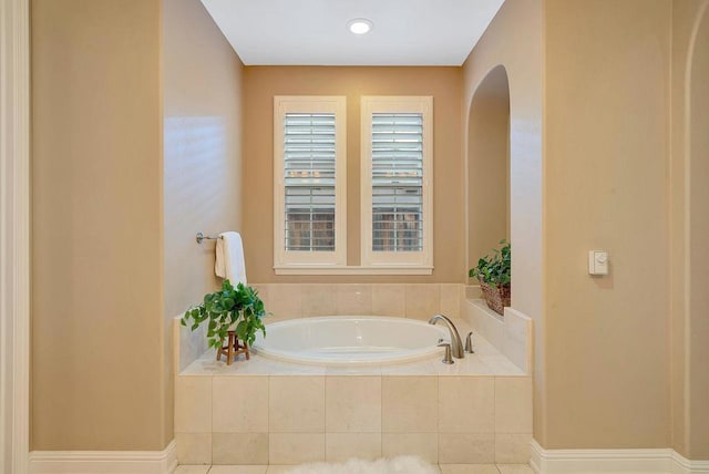 bathroom featuring tiled bath