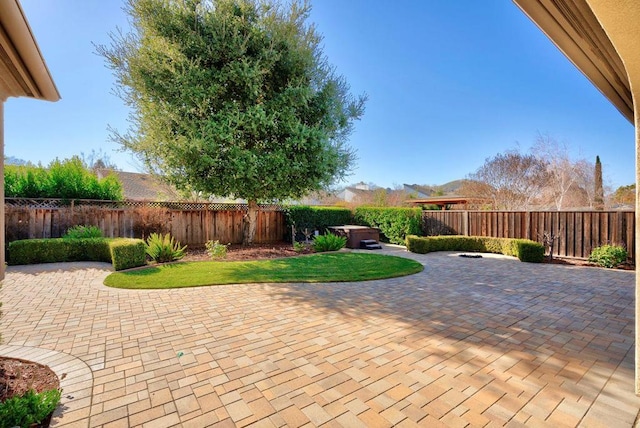 view of patio / terrace featuring a hot tub