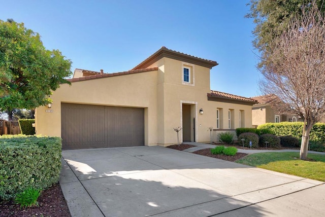 mediterranean / spanish-style house featuring a garage