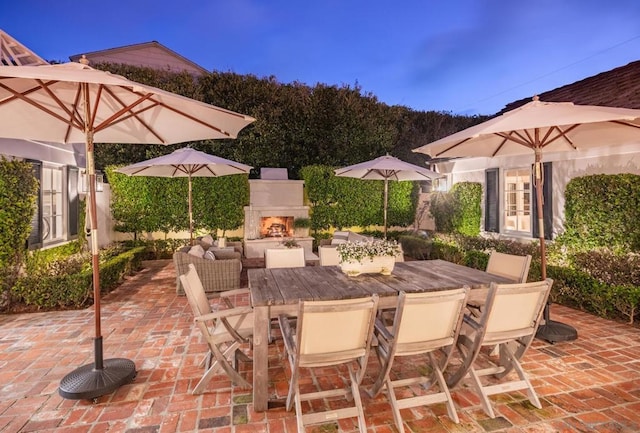 view of patio / terrace with exterior fireplace