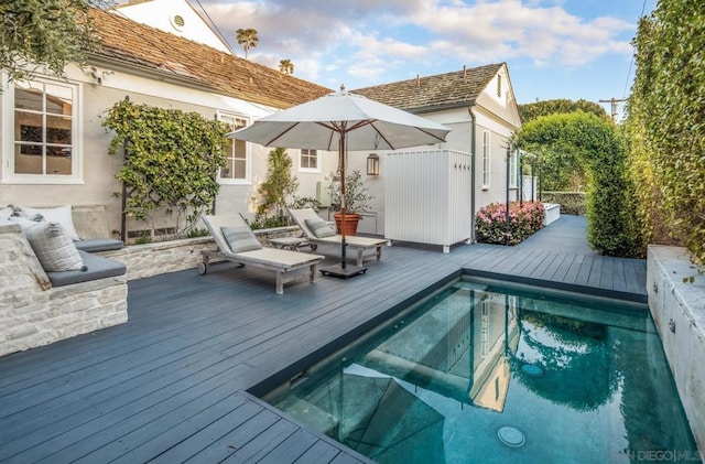 view of pool featuring a wooden deck