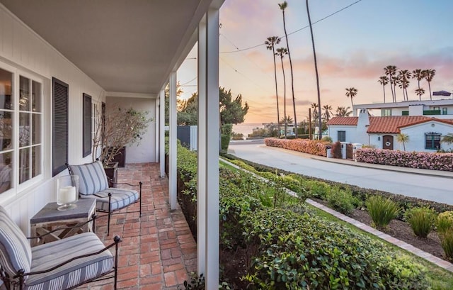 patio terrace at dusk with a porch