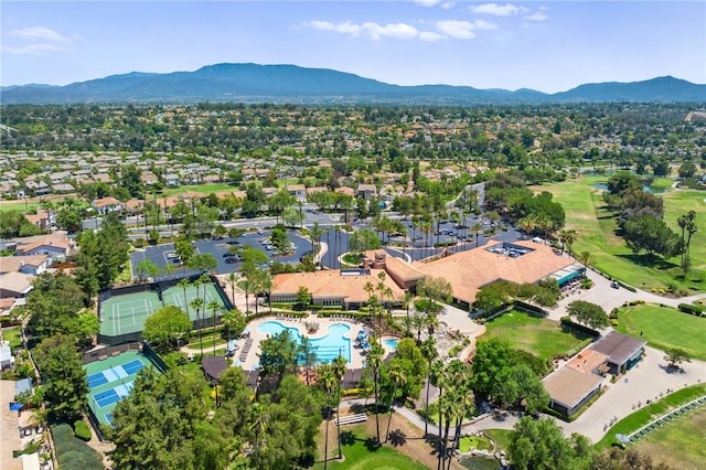 birds eye view of property with a mountain view