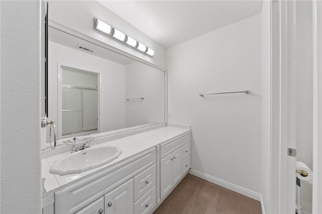 bathroom with vanity and an enclosed shower