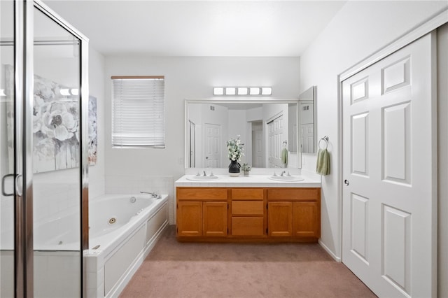 bathroom with vanity and separate shower and tub