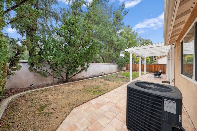 view of patio with a pergola and central AC