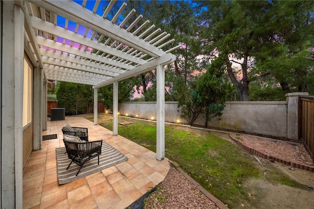 patio terrace at dusk with cooling unit, a yard, and a pergola