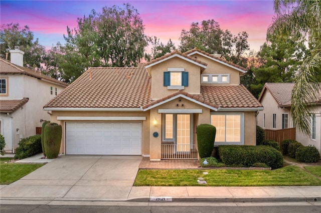 mediterranean / spanish-style home featuring a garage