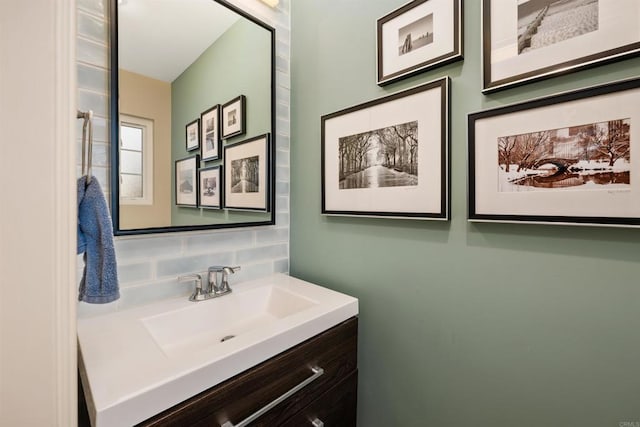 bathroom with vanity and decorative backsplash