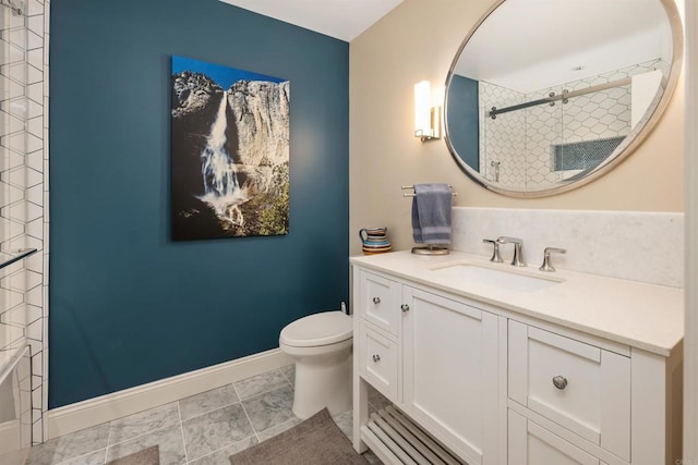 bathroom featuring vanity, tile patterned floors, and toilet