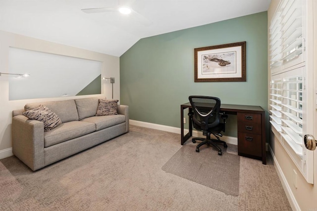 carpeted office with ceiling fan and vaulted ceiling