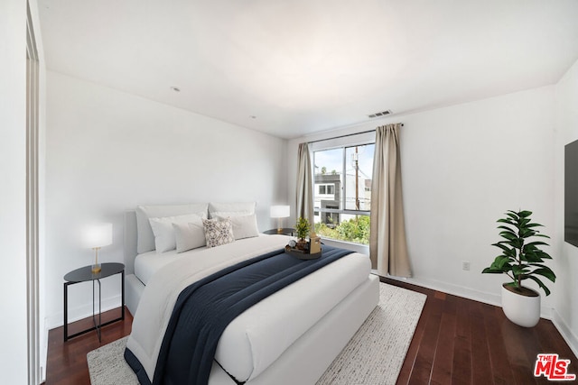 bedroom featuring dark hardwood / wood-style floors