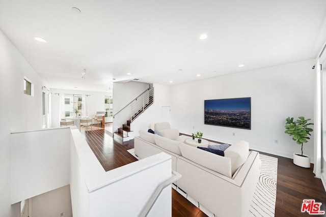 living room featuring dark hardwood / wood-style floors