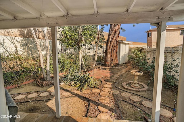 view of patio / terrace with a storage shed