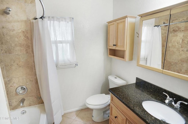 full bathroom featuring vanity, shower / bath combination with curtain, tile patterned floors, and toilet