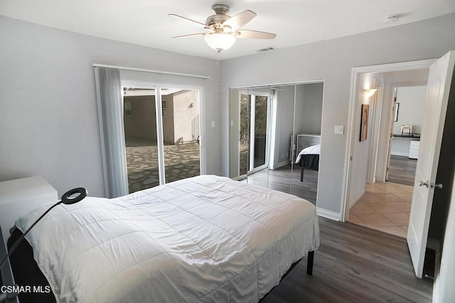 bedroom with dark hardwood / wood-style flooring, access to exterior, and ceiling fan