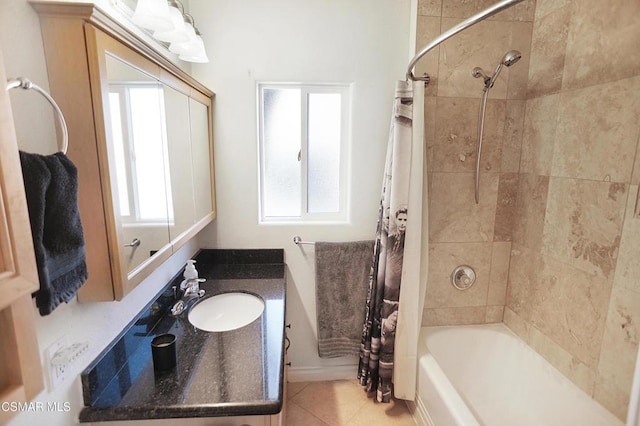 bathroom with tile patterned flooring, vanity, and shower / bath combo