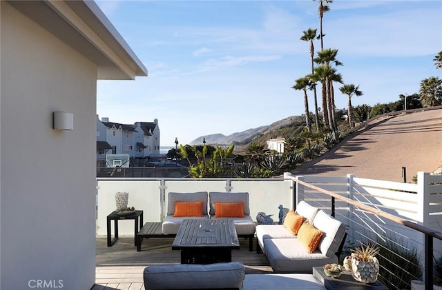 exterior space featuring a mountain view and an outdoor hangout area